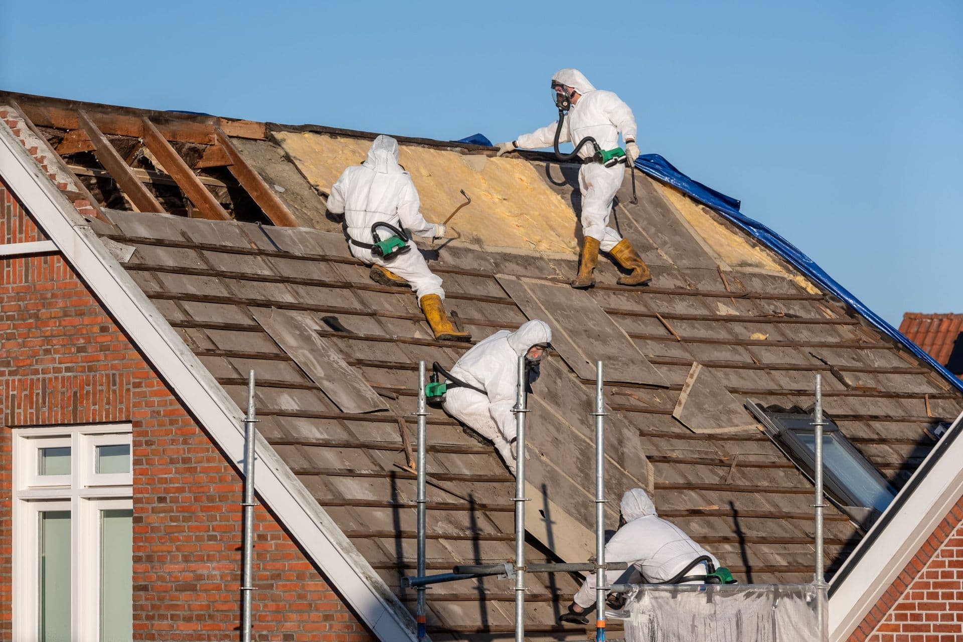 Professionals-In-Protective-Suits-removing-asbestos-clemens-home-solutions-scaled